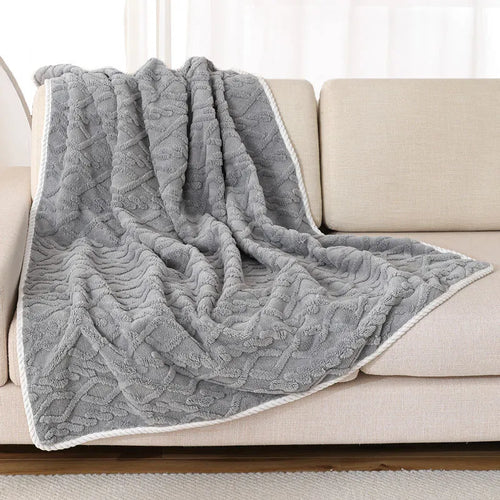 Snuggle Calm Blanket — draped over couch